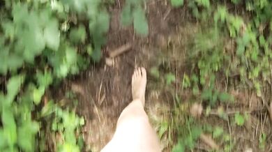 Stripping down while walking on a forest trail and playing with myself