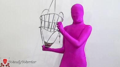 My Iron Maiden Corset is locked over a pink zentai