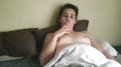 chubby girl smoking a cigarette in bed