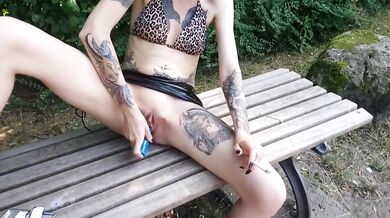 Lucy Ravenblood smoking and diloing her pussy in a public park