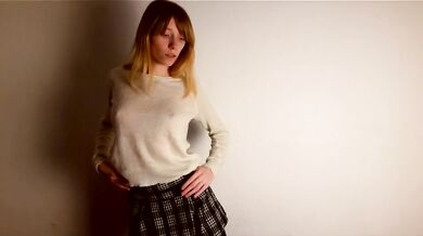 Lustful schoolgirl dancing a striptease
