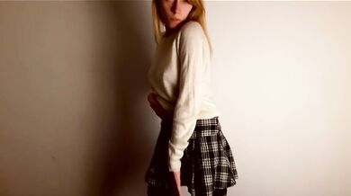 Lustful schoolgirl dancing a striptease