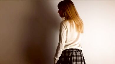 Lustful schoolgirl dancing a striptease