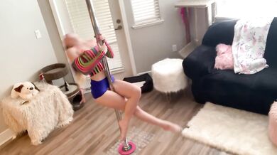 Raver girl gets naked, spreads pussy on pole and twerks