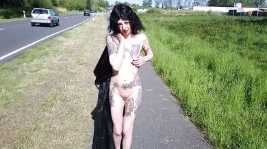 Slut Lucy Ravenblood walking nude at a public road