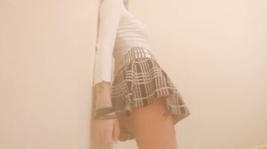 Petite short haired girl dances and strips in front of camera