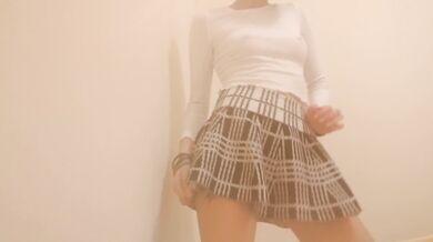 Petite short haired girl dances and strips in front of camera