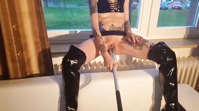 whore fucks herself with a baseball bat at the window for the neighbours