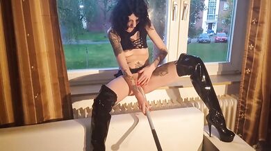 whore fucks herself with a baseball bat at the window for the neighbours
