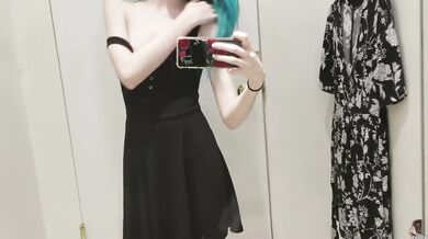 skinny gothic girl taking a selfie at hudson bay dressing room