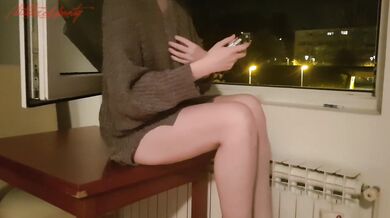 Horny Redhead smoking and jilling at an open window