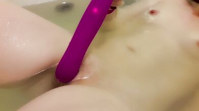 Playing with strapon in the bathroom - clitoral orgasm close up