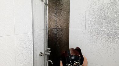 Backstage from the Halloween shoot. Mistress in a gas mask and latex is doused with wine