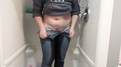 Naughty girl desperately pisses jeans in shower