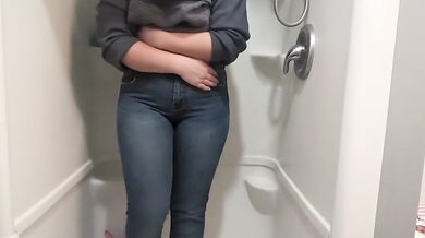 Naughty girl desperately pisses jeans in shower