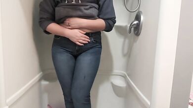 Naughty girl desperately pisses jeans in shower