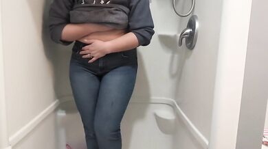 Naughty girl desperately pisses jeans in shower