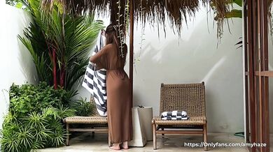 Seductive cleaning by a naked brunette with a BIG ASS in a transparent robe