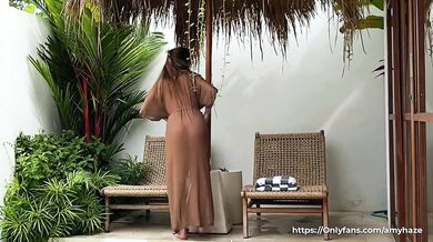 Seductive cleaning by a naked brunette with a BIG ASS in a transparent robe