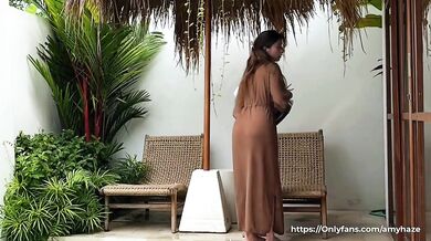 Seductive cleaning by a naked brunette with a BIG ASS in a transparent robe