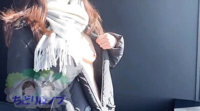 A beautiful woman who walks around the city naked in the middle of winter with just a coat