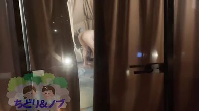 A beautiful Japanese woman is glamping naked in a skeleton dome tent.
