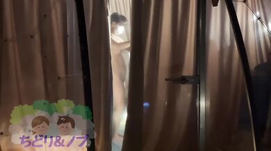A beautiful Japanese woman is glamping naked in a skeleton dome tent.