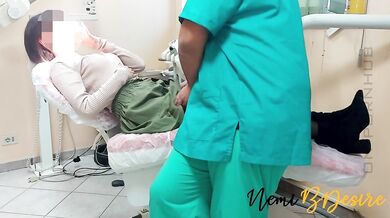 The services of the dentist and his assistant give a beautiful smile to the young and eager patient