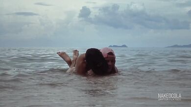 Hot & risky sex in the sea waves on the beach
