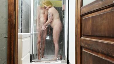 Femdom. Mommy removes the cage from her stepson's penis, lets him pee and washes him in the shower.