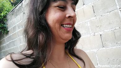 Amateur wife teasing you outside wearing a micro bikini