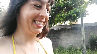 Amateur wife teasing you outside wearing a micro bikini