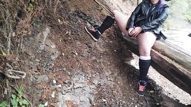 Milf fucks herself with huge dildo beside public river