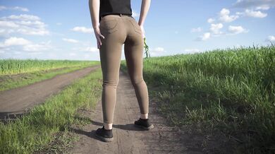 Sexy Milf Walks Outdoors And Teases Cute Panty Lines