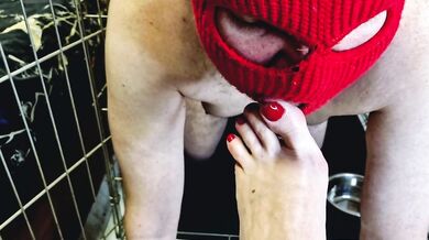 Domina Nika allows the slave to crawl out of the cage so that he kisses, licks her feet, sucks toes