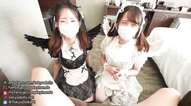 Japanese girls dressed as a Lucifer gives a guy a handjob while drooling.