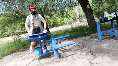 Risky workout in a public park: tiny skirt and no panties