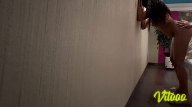 A submissive woman with black hair is penetrated