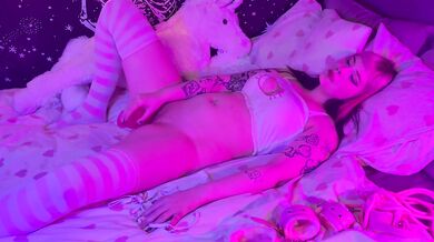 Petite goth girl plays with pink dildo