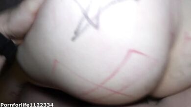 Obsessed girl tied to the bed getting exorcism by the priest Halloween