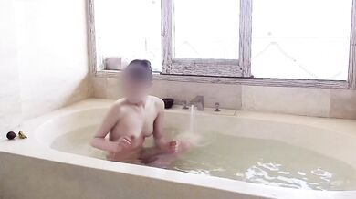 Age gap couple bathing in the resort bath.