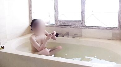 Age gap couple bathing in the resort bath.
