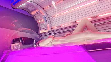 Milf touching her wet pussy in solarium