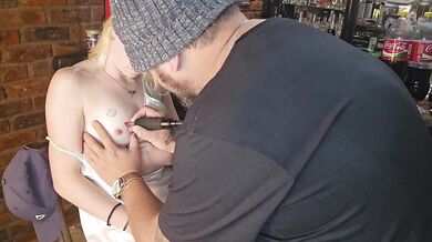 Hot cute blonde gets tatoo next to her nipple