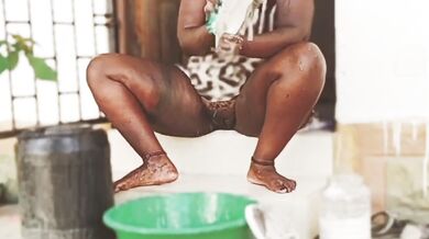 African babe legs apart no panty washing shoes PUSSY SHOWING