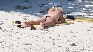 Milf relaxing on beach and masturbation