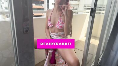 stripping my bikini and using my vibrator on the balcony... i hope they watch