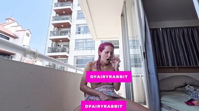 stripping and playing on the balcony... i hope the neighbors are watching me