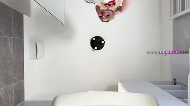 Sexy beauty cute blonde horny girl in pink panties and with a satin nightie does the bathroom routine before going to the bed