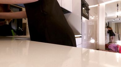 Hot sexy long legs brunette wife in black and red fishnet stockings with a satin nightie teases in the kitchen